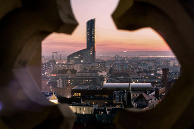 Buildings seen through railing in city