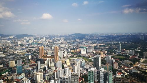 Aerial view of cityscape against sky