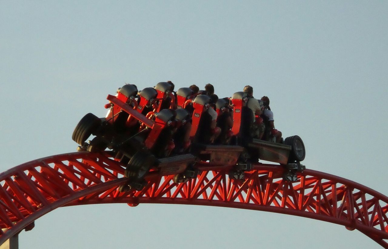 clear sky, low angle view, copy space, red, metal, sky, no people, outdoors, close-up, arts culture and entertainment, part of, transportation, day, cultures, metallic, in a row, culture, connection, travel, hanging