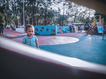 Cute boy playing in playground