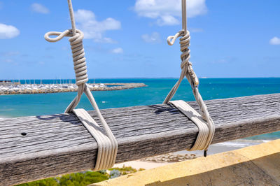 Close-up of wooden railing at bathers beach, fremantle