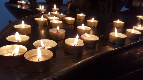 Close-up of lit tea light candles