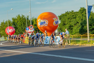 People riding bicycles on road