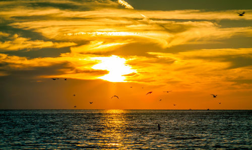 Scenic view of sea against sky during sunset