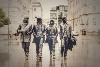 Digital composite image of people walking on street