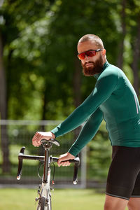 Young man riding bicycle