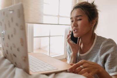 Young woman using laptop at home