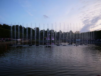 Panoramic view of lake by buildings against sky