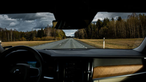 Road seen through car windshield