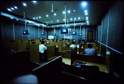 Office workers sitting in cubicle