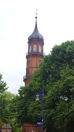 Low angle view of clock tower against sky