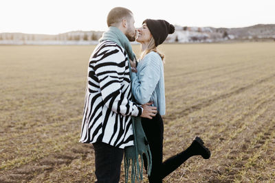 Couple kissing in the countryside embraced. boyfriend and girlfriend in love