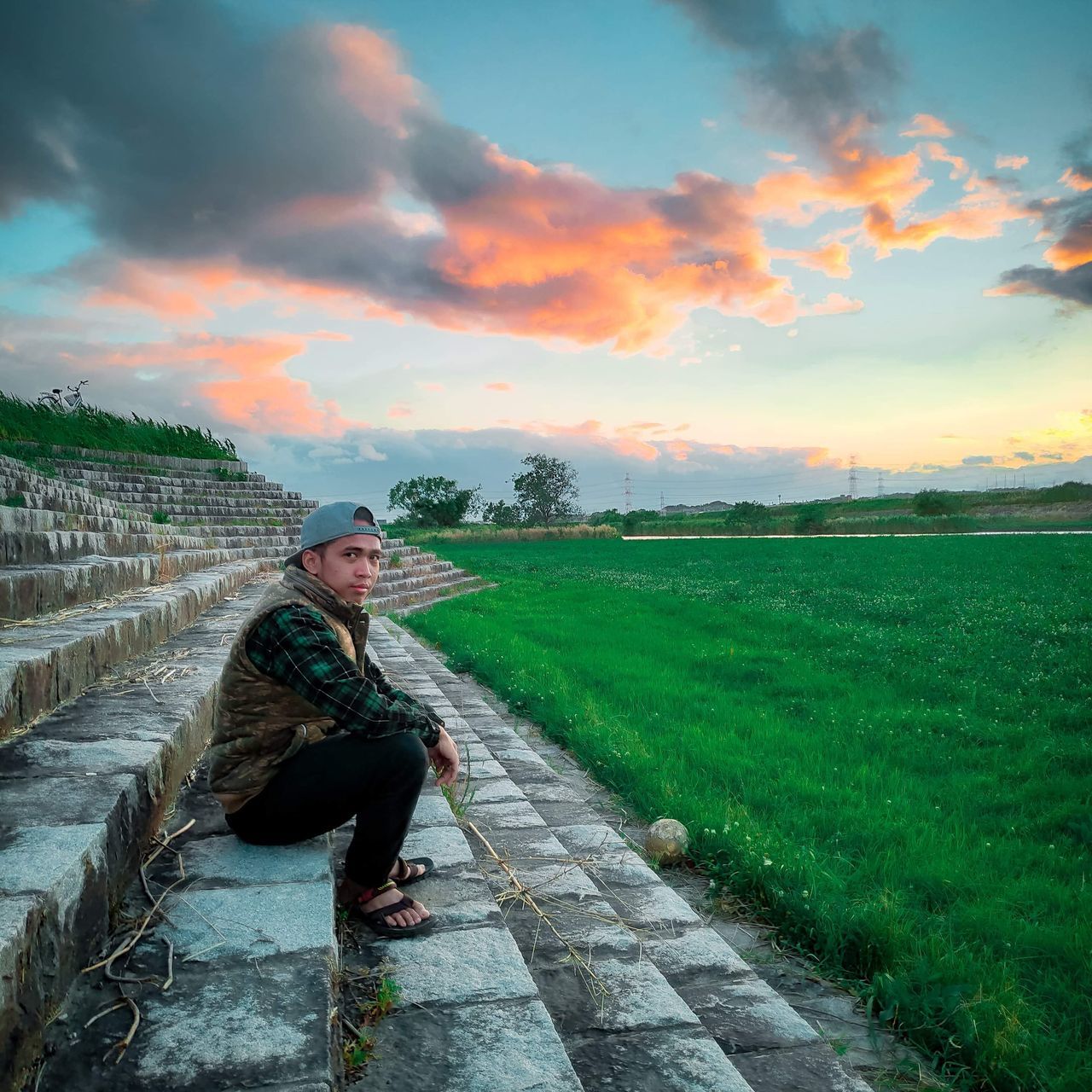 sky, one person, cloud, full length, adult, nature, morning, plant, landscape, sunlight, environment, beauty in nature, footpath, rural scene, outdoors, lifestyles, grass, rural area, land, clothing, field, agriculture, side view, green, men, person, scenics - nature, hat, leisure activity, horizon, farm