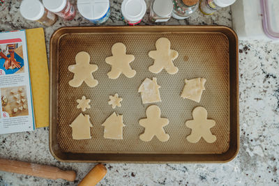 Overhead shot of cut out cookies on a baking sheet