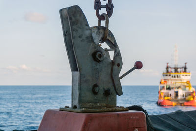 A quick release hook of a lifeboat onboard a construction work barge at terengganu oil field