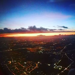 Aerial view of landscape against sky at sunset