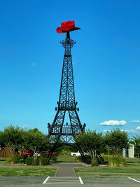 Low angle view of red tower against sky