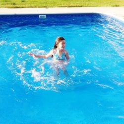 High angle view of teenage girl in swimming pool