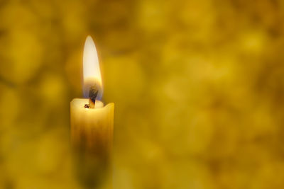 Close-up of illuminated candle