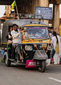 People on road in city