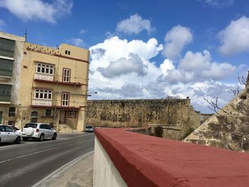 Road in city against sky