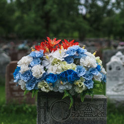 Close-up of rose bouquet in cemetery