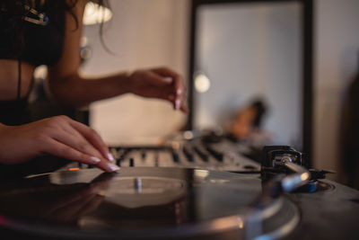 Midsection of woman playing music