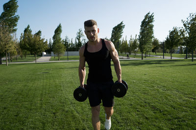 Portrait of man exercising in gym