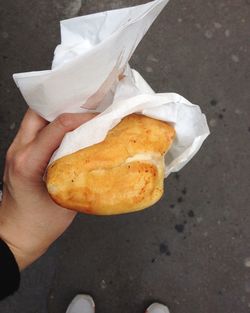 Close-up of cropped hand holding ice cream