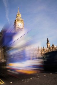 Blurred motion of bus against big ben in city