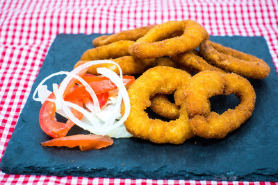 Close-up of fried food with vegetables on table