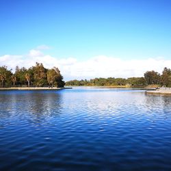 Scenic view of lake against blue sky