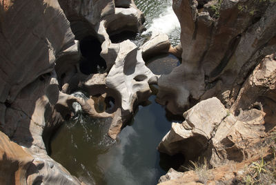 Close-up of rock formations in water
