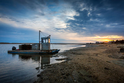 Scenic view of beach against sky during sunset