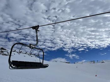 Low angle view of snow covered landscape against sky