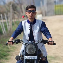 Smiling man riding bicycle