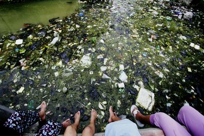 Low section of people against garbage