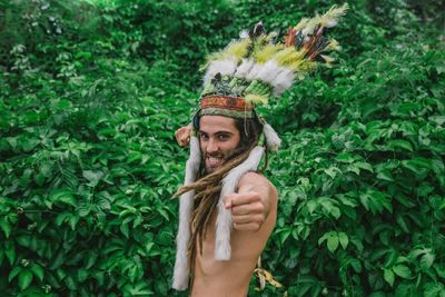 Portrait of smiling young man standing outdoors