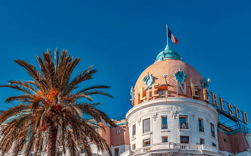 Low angle view of building against blue sky