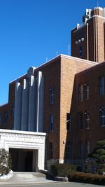 Low angle view of building against blue sky