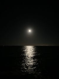 Scenic view of sea against sky at night