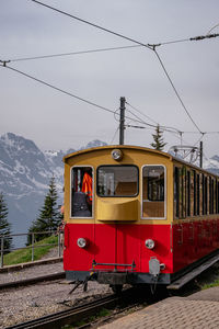 Train on railroad track against sky