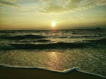 Scenic view of sea at sunset