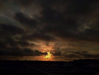 Scenic view of landscape against dramatic sky