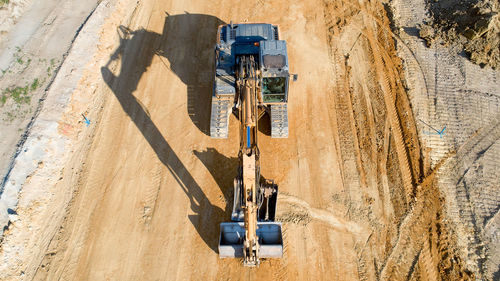 High angle view of bulldozer at coal mine