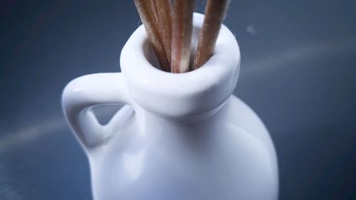 Close-up of coffee cup against white background