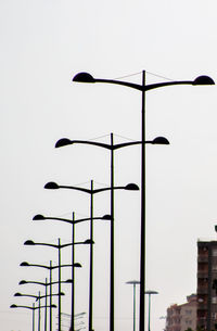 Low angle view of street light against sky