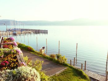 Scenic view of sea with mountain range in background