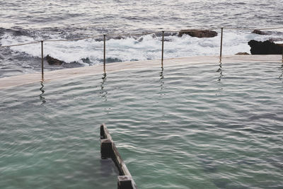 High angle view of wooden post in sea