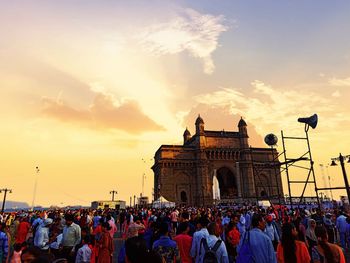 Group of people against sky during sunset